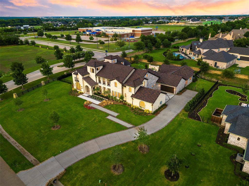 892 Ethel Marie Drive Home in Fairview, Texas. Discover the epitome of luxury living in this stunning Homes By J. Anthony masterpiece, boasting over 7,800 sq ft in Fairview's prestigious Chamberlain Place subdivision. This meticulously updated one-story design offers an array of features, including a gourmet kitchen, wine bar, spacious bedrooms, and a pool overlooking an outdoor dining area.