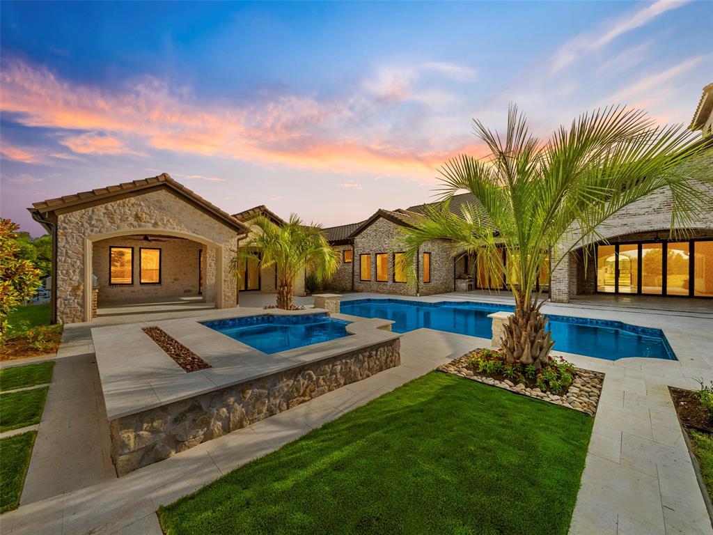 892 Ethel Marie Drive Home in Fairview, Texas. Discover the epitome of luxury living in this stunning Homes By J. Anthony masterpiece, boasting over 7,800 sq ft in Fairview's prestigious Chamberlain Place subdivision. This meticulously updated one-story design offers an array of features, including a gourmet kitchen, wine bar, spacious bedrooms, and a pool overlooking an outdoor dining area.
