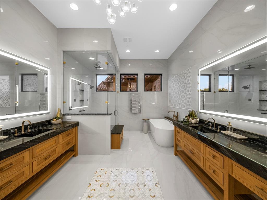 892 Ethel Marie Drive Home in Fairview, Texas. Discover the epitome of luxury living in this stunning Homes By J. Anthony masterpiece, boasting over 7,800 sq ft in Fairview's prestigious Chamberlain Place subdivision. This meticulously updated one-story design offers an array of features, including a gourmet kitchen, wine bar, spacious bedrooms, and a pool overlooking an outdoor dining area.