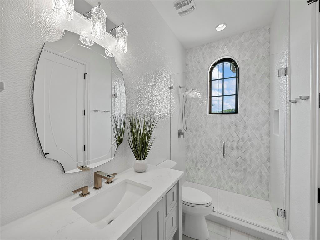 892 Ethel Marie Drive Home in Fairview, Texas. Discover the epitome of luxury living in this stunning Homes By J. Anthony masterpiece, boasting over 7,800 sq ft in Fairview's prestigious Chamberlain Place subdivision. This meticulously updated one-story design offers an array of features, including a gourmet kitchen, wine bar, spacious bedrooms, and a pool overlooking an outdoor dining area.