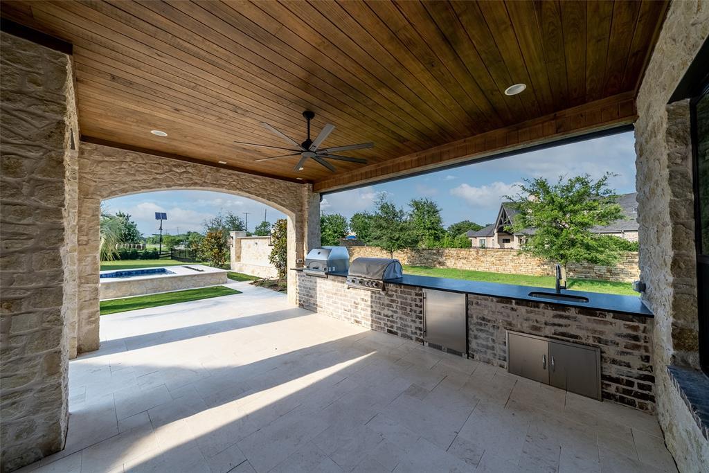 892 Ethel Marie Drive Home in Fairview, Texas. Discover the epitome of luxury living in this stunning Homes By J. Anthony masterpiece, boasting over 7,800 sq ft in Fairview's prestigious Chamberlain Place subdivision. This meticulously updated one-story design offers an array of features, including a gourmet kitchen, wine bar, spacious bedrooms, and a pool overlooking an outdoor dining area.