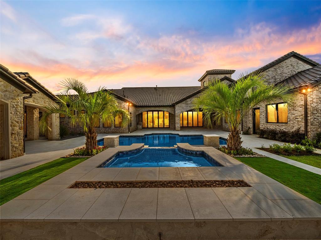 892 Ethel Marie Drive Home in Fairview, Texas. Discover the epitome of luxury living in this stunning Homes By J. Anthony masterpiece, boasting over 7,800 sq ft in Fairview's prestigious Chamberlain Place subdivision. This meticulously updated one-story design offers an array of features, including a gourmet kitchen, wine bar, spacious bedrooms, and a pool overlooking an outdoor dining area.