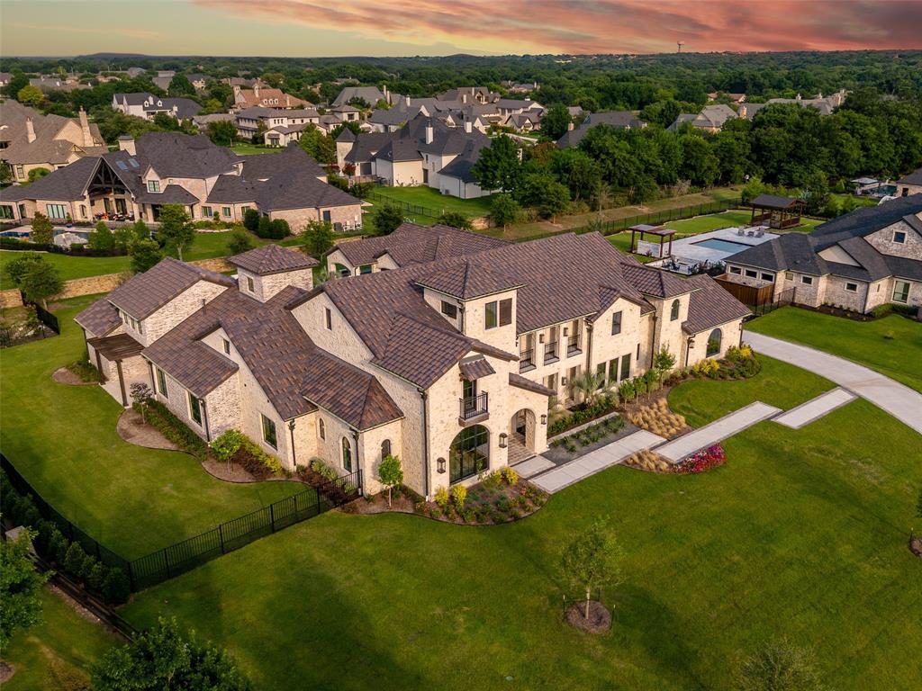 892 Ethel Marie Drive Home in Fairview, Texas. Discover the epitome of luxury living in this stunning Homes By J. Anthony masterpiece, boasting over 7,800 sq ft in Fairview's prestigious Chamberlain Place subdivision. This meticulously updated one-story design offers an array of features, including a gourmet kitchen, wine bar, spacious bedrooms, and a pool overlooking an outdoor dining area.