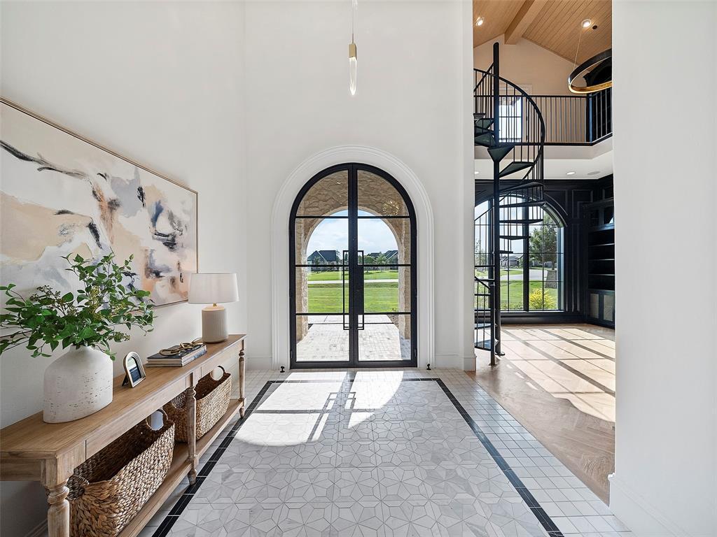 892 Ethel Marie Drive Home in Fairview, Texas. Discover the epitome of luxury living in this stunning Homes By J. Anthony masterpiece, boasting over 7,800 sq ft in Fairview's prestigious Chamberlain Place subdivision. This meticulously updated one-story design offers an array of features, including a gourmet kitchen, wine bar, spacious bedrooms, and a pool overlooking an outdoor dining area.