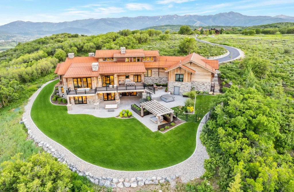 977 West Deer Hill Home in Park City, Utah. Discover opulent mountain living in this 4-bedroom, 6,103 sq ft modern home in Park City's exclusive Preserve community. With stunning views, spacious living areas, and exceptional features like radiant heat, a backup generator, and proximity to outdoor trails, this retreat offers unparalleled luxury and tranquility.