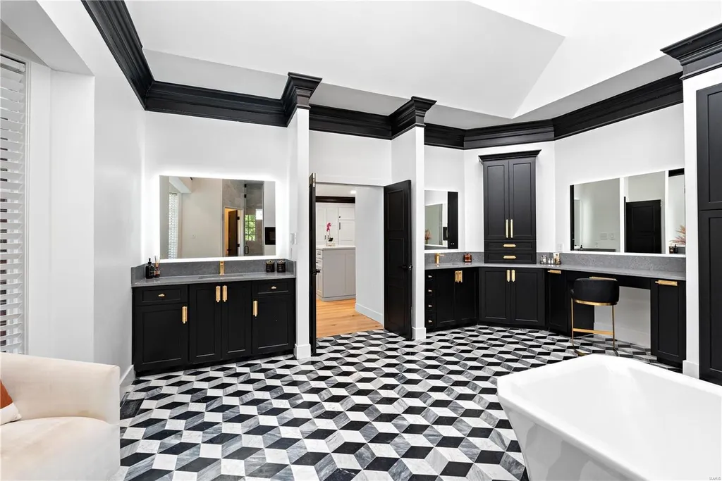 9948 Litzsinger Road Home in Saint Louis, Missouri. Step into the timeless charm of Galloway Manor, a beautifully renovated Tudor estate that seamlessly blends historic character with modern luxury. Enjoy stunning entertaining spaces, a designer kitchen, a courtyard terrace overlooking the pool and tennis court, a main floor primary suite with a showstopping walk-in closet, and much more. 