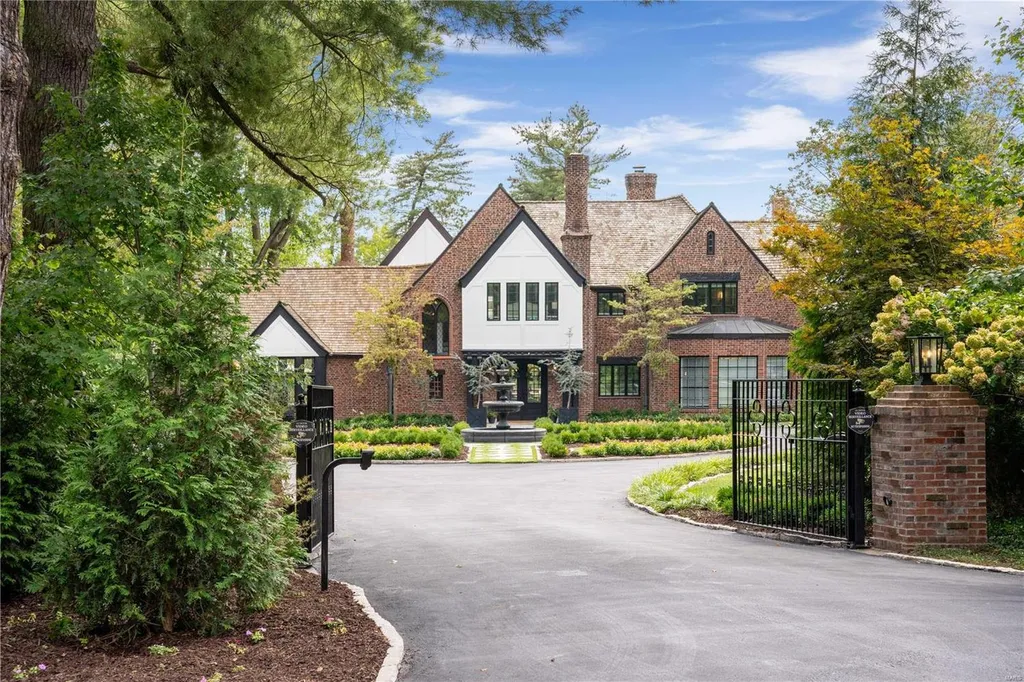 9948 Litzsinger Road Home in Saint Louis, Missouri. Step into the timeless charm of Galloway Manor, a beautifully renovated Tudor estate that seamlessly blends historic character with modern luxury. Enjoy stunning entertaining spaces, a designer kitchen, a courtyard terrace overlooking the pool and tennis court, a main floor primary suite with a showstopping walk-in closet, and much more. 