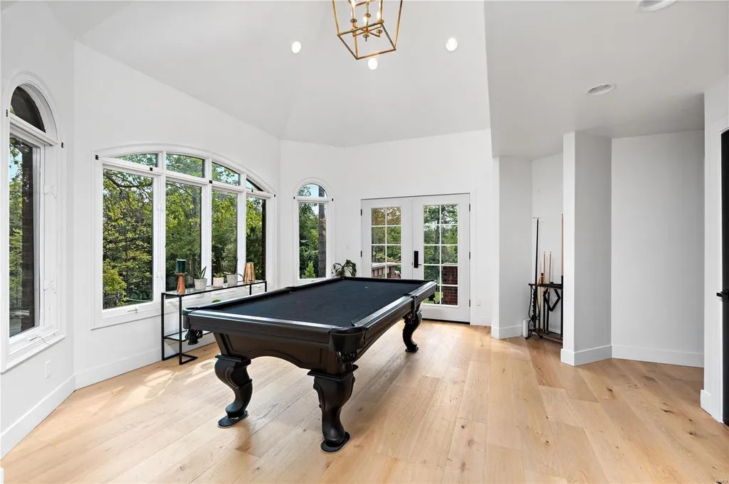 9948 Litzsinger Road Home in Saint Louis, Missouri. Step into the timeless charm of Galloway Manor, a beautifully renovated Tudor estate that seamlessly blends historic character with modern luxury. Enjoy stunning entertaining spaces, a designer kitchen, a courtyard terrace overlooking the pool and tennis court, a main floor primary suite with a showstopping walk-in closet, and much more. 