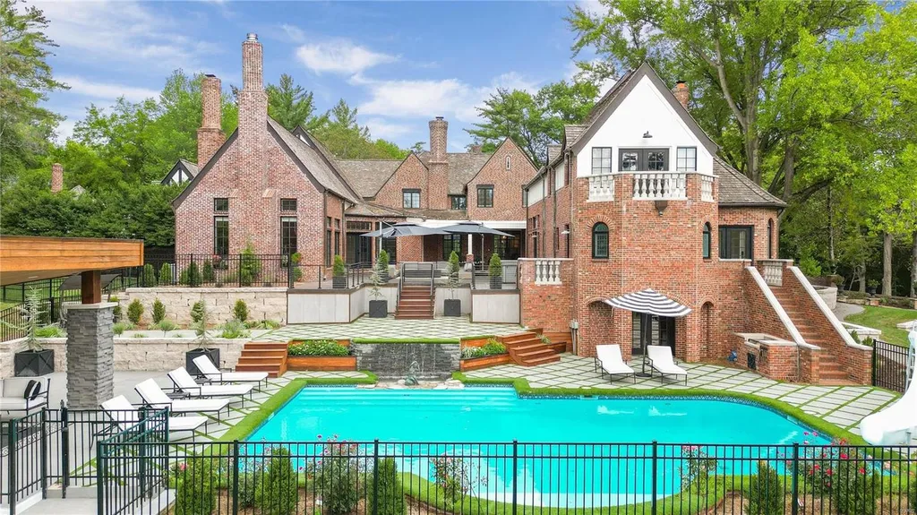 9948 Litzsinger Road Home in Saint Louis, Missouri. Step into the timeless charm of Galloway Manor, a beautifully renovated Tudor estate that seamlessly blends historic character with modern luxury. Enjoy stunning entertaining spaces, a designer kitchen, a courtyard terrace overlooking the pool and tennis court, a main floor primary suite with a showstopping walk-in closet, and much more. 