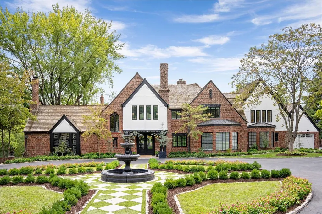 9948 Litzsinger Road Home in Saint Louis, Missouri. Step into the timeless charm of Galloway Manor, a beautifully renovated Tudor estate that seamlessly blends historic character with modern luxury. Enjoy stunning entertaining spaces, a designer kitchen, a courtyard terrace overlooking the pool and tennis court, a main floor primary suite with a showstopping walk-in closet, and much more. 