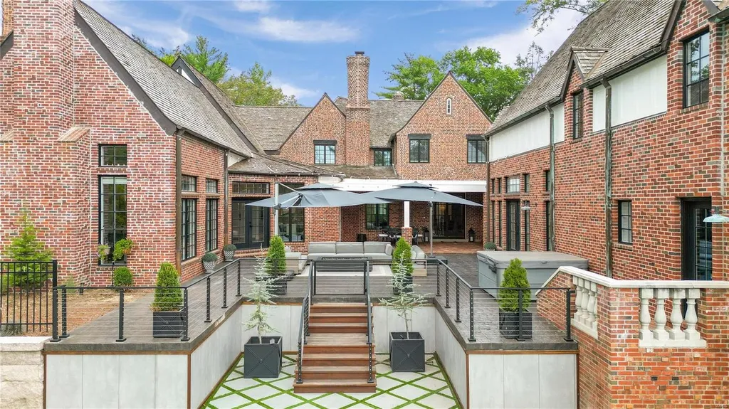 9948 Litzsinger Road Home in Saint Louis, Missouri. Step into the timeless charm of Galloway Manor, a beautifully renovated Tudor estate that seamlessly blends historic character with modern luxury. Enjoy stunning entertaining spaces, a designer kitchen, a courtyard terrace overlooking the pool and tennis court, a main floor primary suite with a showstopping walk-in closet, and much more. 