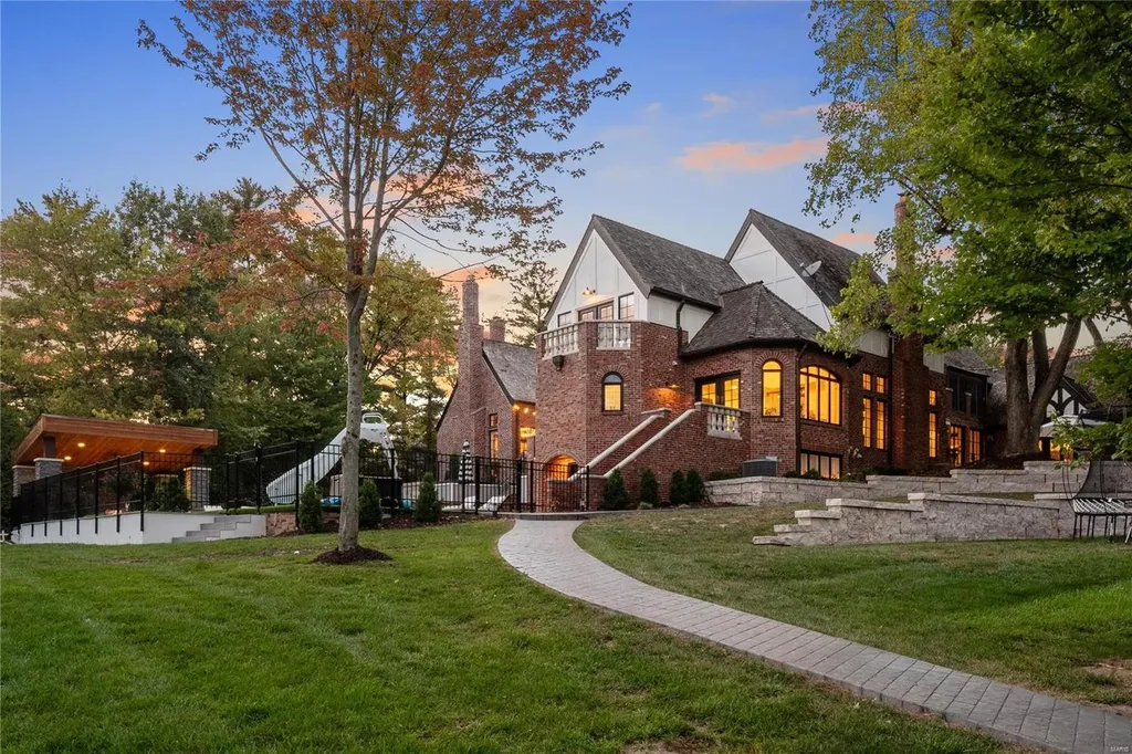9948 Litzsinger Road Home in Saint Louis, Missouri. Step into the timeless charm of Galloway Manor, a beautifully renovated Tudor estate that seamlessly blends historic character with modern luxury. Enjoy stunning entertaining spaces, a designer kitchen, a courtyard terrace overlooking the pool and tennis court, a main floor primary suite with a showstopping walk-in closet, and much more. 