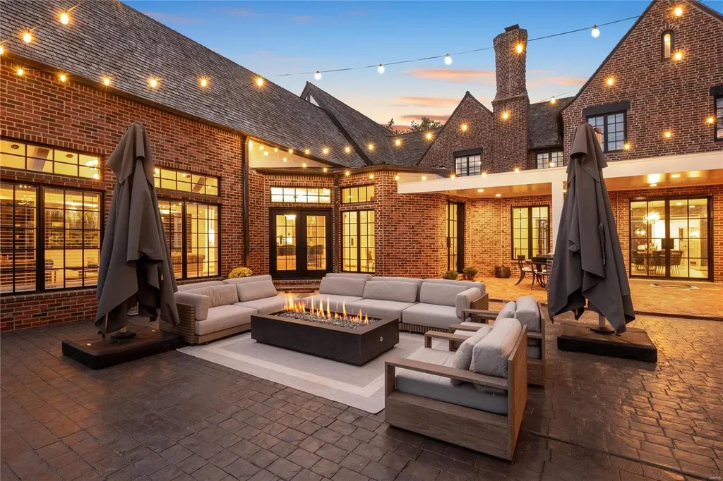 9948 Litzsinger Road Home in Saint Louis, Missouri. Step into the timeless charm of Galloway Manor, a beautifully renovated Tudor estate that seamlessly blends historic character with modern luxury. Enjoy stunning entertaining spaces, a designer kitchen, a courtyard terrace overlooking the pool and tennis court, a main floor primary suite with a showstopping walk-in closet, and much more. 