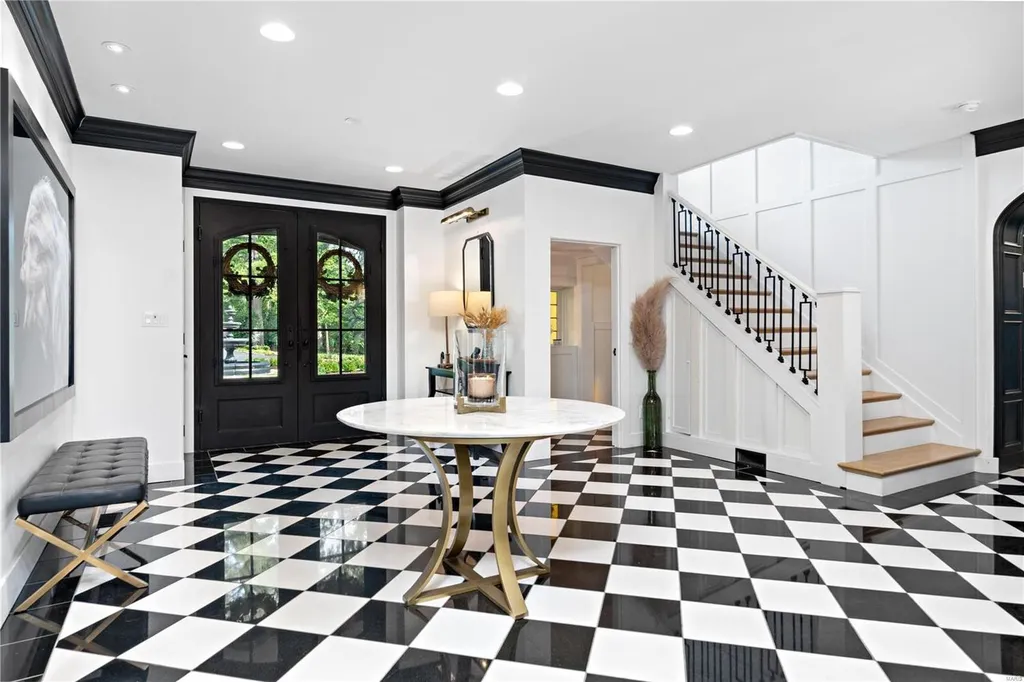 9948 Litzsinger Road Home in Saint Louis, Missouri. Step into the timeless charm of Galloway Manor, a beautifully renovated Tudor estate that seamlessly blends historic character with modern luxury. Enjoy stunning entertaining spaces, a designer kitchen, a courtyard terrace overlooking the pool and tennis court, a main floor primary suite with a showstopping walk-in closet, and much more. 