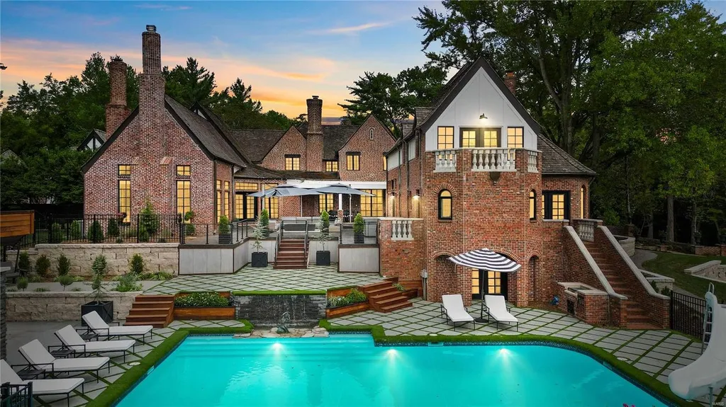 9948 Litzsinger Road Home in Saint Louis, Missouri. Step into the timeless charm of Galloway Manor, a beautifully renovated Tudor estate that seamlessly blends historic character with modern luxury. Enjoy stunning entertaining spaces, a designer kitchen, a courtyard terrace overlooking the pool and tennis court, a main floor primary suite with a showstopping walk-in closet, and much more. 