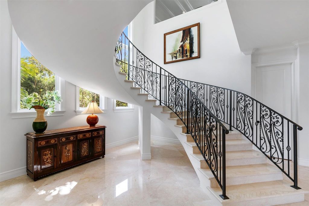 Discover the epitome of waterfront luxury living at 2521 Mercedes Dr, Fort Lauderdale, FL. Nestled in the prestigious Harbor Beach gated community, this 7-bed, 8-bath estate boasts 7,484 square feet of exquisite design.