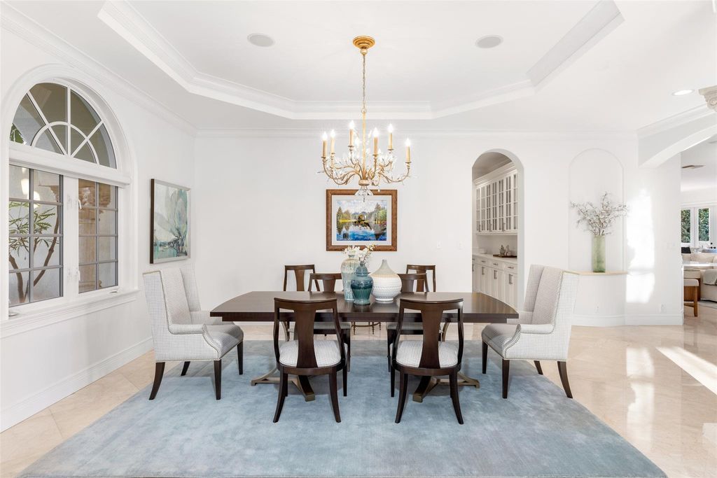 Discover the epitome of waterfront luxury living at 2521 Mercedes Dr, Fort Lauderdale, FL. Nestled in the prestigious Harbor Beach gated community, this 7-bed, 8-bath estate boasts 7,484 square feet of exquisite design.