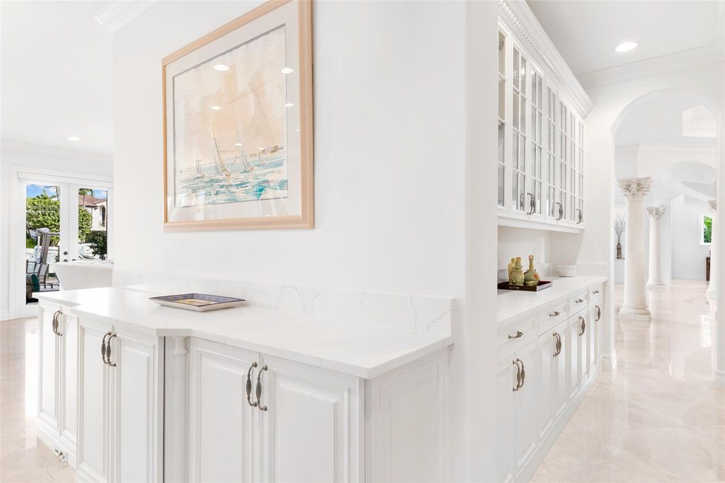 Discover the epitome of waterfront luxury living at 2521 Mercedes Dr, Fort Lauderdale, FL. Nestled in the prestigious Harbor Beach gated community, this 7-bed, 8-bath estate boasts 7,484 square feet of exquisite design.