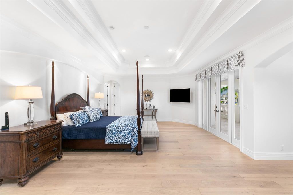 Discover the epitome of waterfront luxury living at 2521 Mercedes Dr, Fort Lauderdale, FL. Nestled in the prestigious Harbor Beach gated community, this 7-bed, 8-bath estate boasts 7,484 square feet of exquisite design.