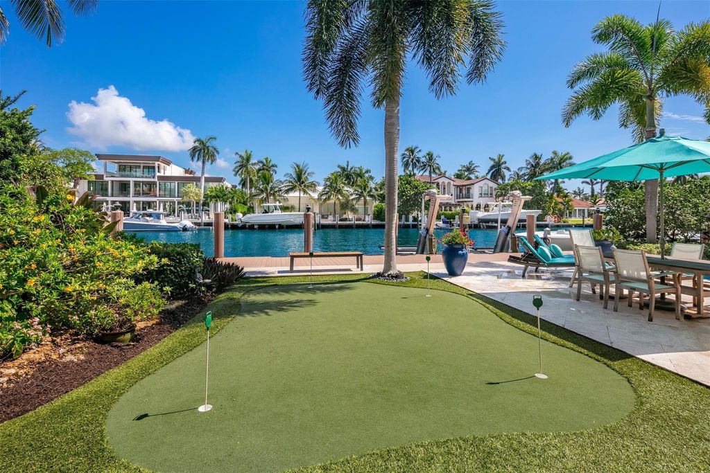 Discover the epitome of waterfront luxury living at 2521 Mercedes Dr, Fort Lauderdale, FL. Nestled in the prestigious Harbor Beach gated community, this 7-bed, 8-bath estate boasts 7,484 square feet of exquisite design.