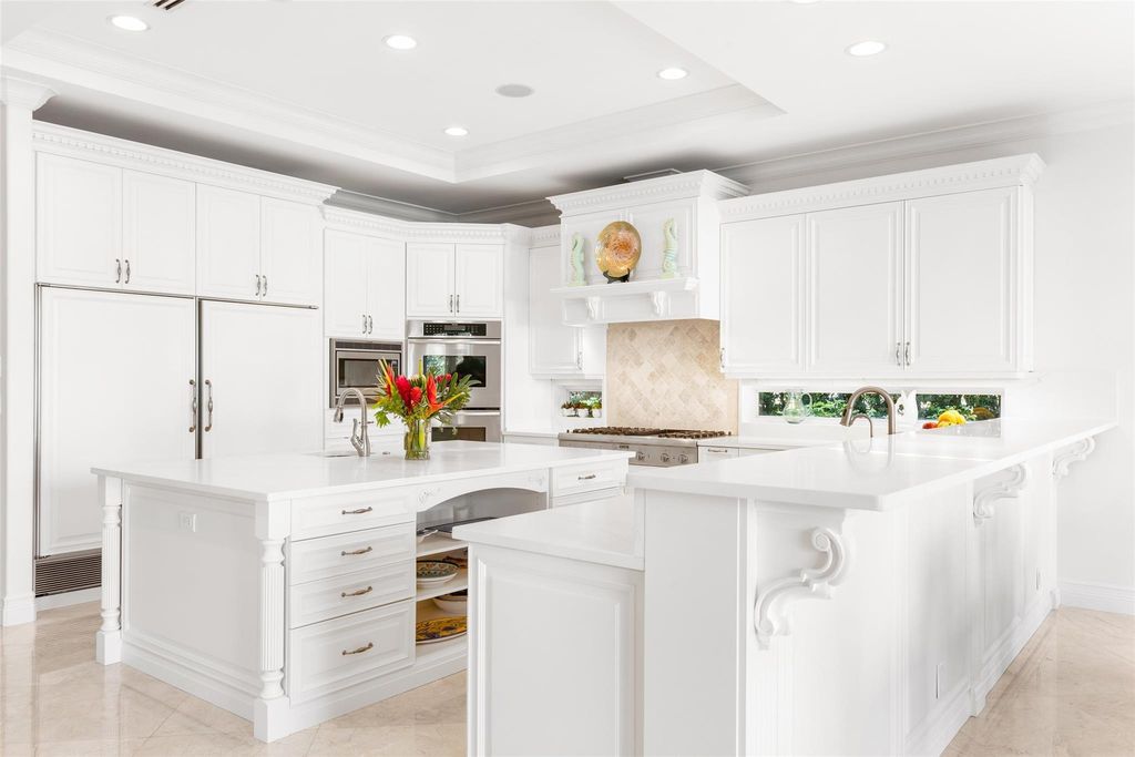 Discover the epitome of waterfront luxury living at 2521 Mercedes Dr, Fort Lauderdale, FL. Nestled in the prestigious Harbor Beach gated community, this 7-bed, 8-bath estate boasts 7,484 square feet of exquisite design.