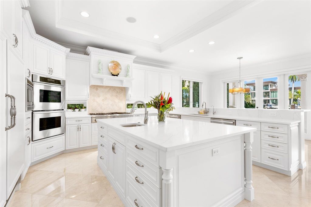 Discover the epitome of waterfront luxury living at 2521 Mercedes Dr, Fort Lauderdale, FL. Nestled in the prestigious Harbor Beach gated community, this 7-bed, 8-bath estate boasts 7,484 square feet of exquisite design.