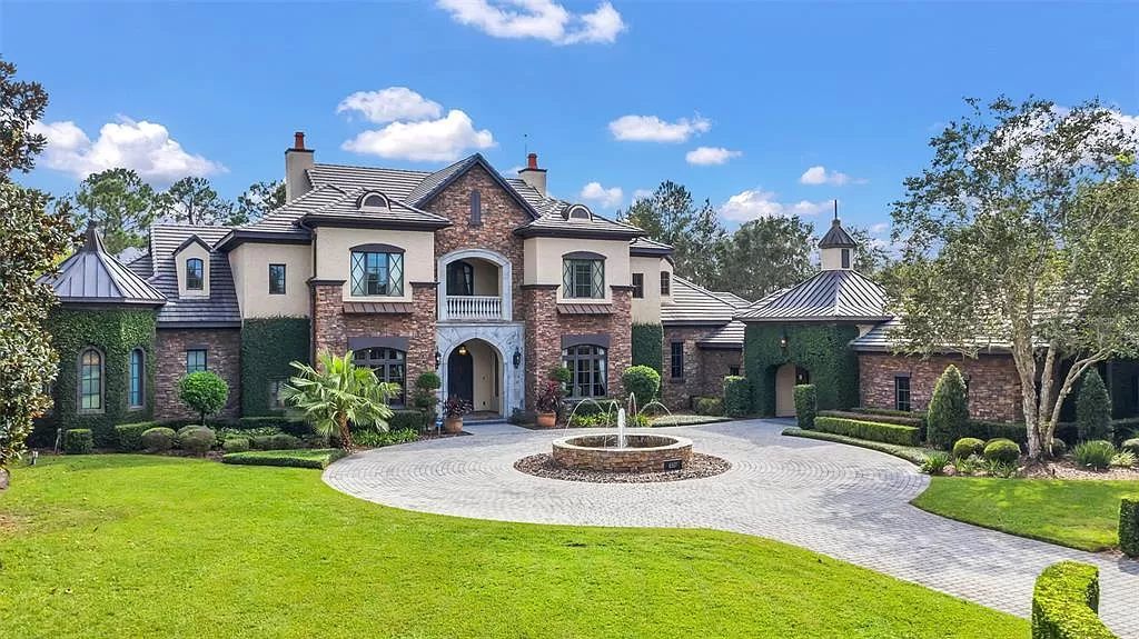 Situated within Windermere's exclusive community, this 10,485-square-foot estate at 6507 Rosella Ct embodies luxury living at its peak. Built by Stonebridge Custom Homes in 2007, the 7-bedroom, 8-bathroom property features an impressive array of amenities including a grand atrium with stunning lake views, a theater, two swimming pools, a spa, and an outdoor kitchen.