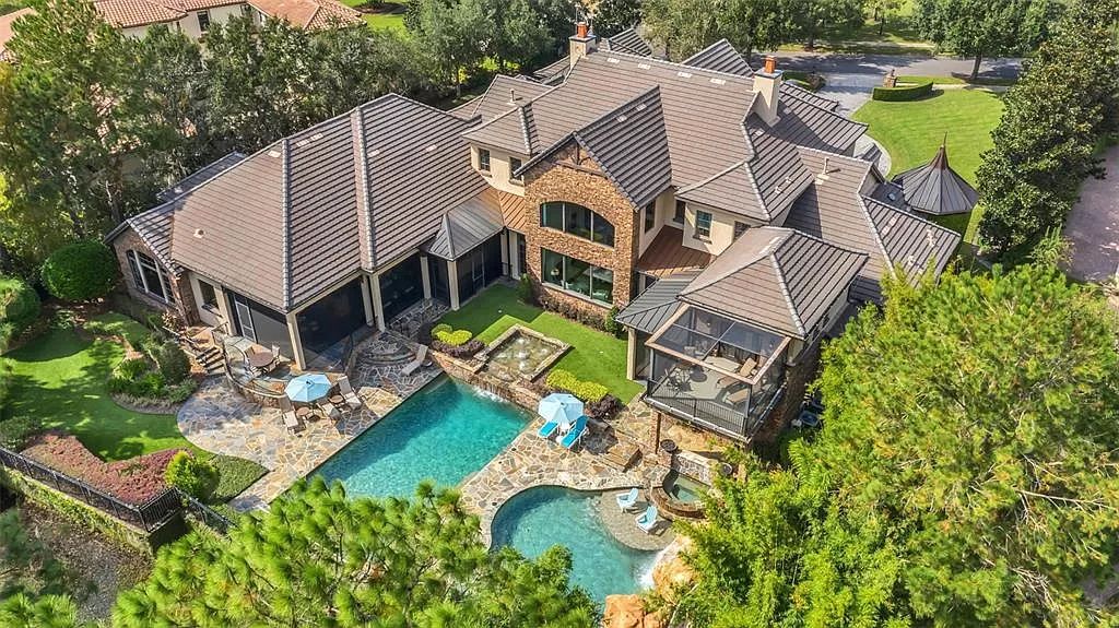 Situated within Windermere's exclusive community, this 10,485-square-foot estate at 6507 Rosella Ct embodies luxury living at its peak. Built by Stonebridge Custom Homes in 2007, the 7-bedroom, 8-bathroom property features an impressive array of amenities including a grand atrium with stunning lake views, a theater, two swimming pools, a spa, and an outdoor kitchen.