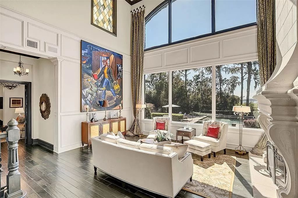 Situated within Windermere's exclusive community, this 10,485-square-foot estate at 6507 Rosella Ct embodies luxury living at its peak. Built by Stonebridge Custom Homes in 2007, the 7-bedroom, 8-bathroom property features an impressive array of amenities including a grand atrium with stunning lake views, a theater, two swimming pools, a spa, and an outdoor kitchen.