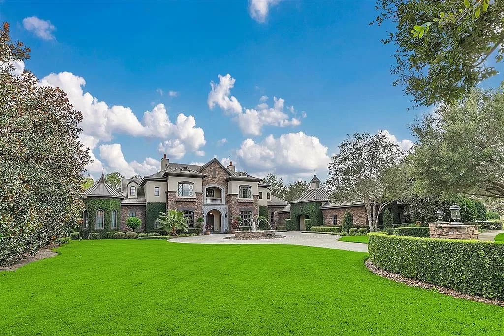 Situated within Windermere's exclusive community, this 10,485-square-foot estate at 6507 Rosella Ct embodies luxury living at its peak. Built by Stonebridge Custom Homes in 2007, the 7-bedroom, 8-bathroom property features an impressive array of amenities including a grand atrium with stunning lake views, a theater, two swimming pools, a spa, and an outdoor kitchen.