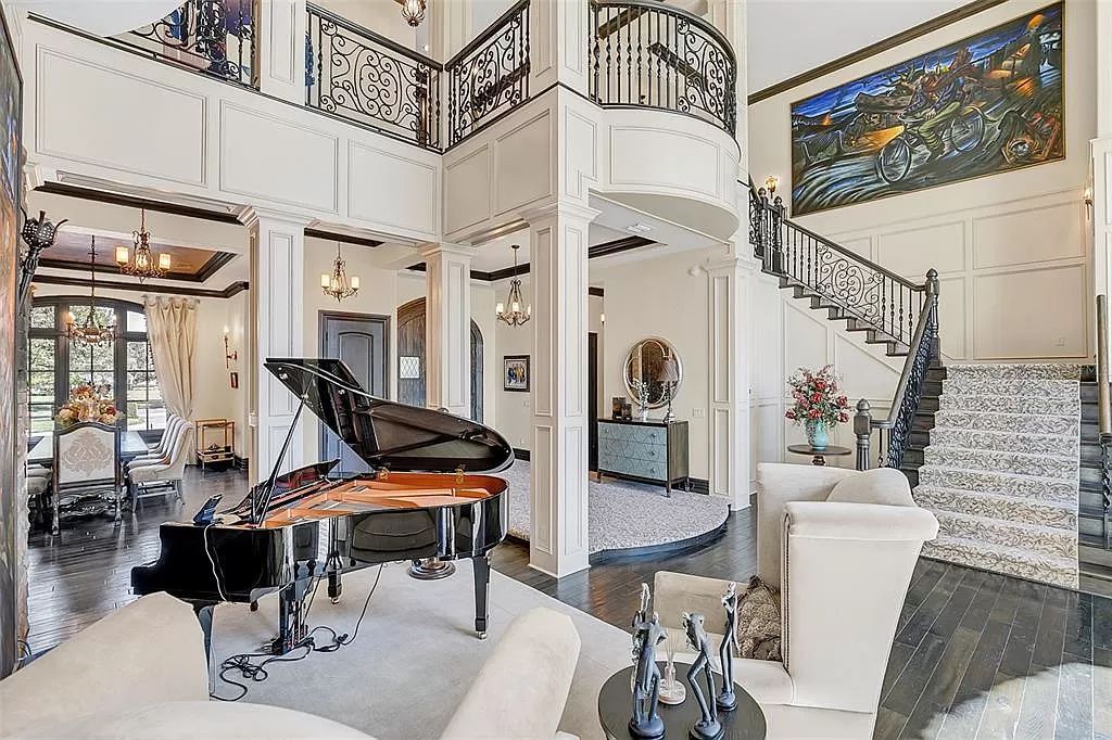 Situated within Windermere's exclusive community, this 10,485-square-foot estate at 6507 Rosella Ct embodies luxury living at its peak. Built by Stonebridge Custom Homes in 2007, the 7-bedroom, 8-bathroom property features an impressive array of amenities including a grand atrium with stunning lake views, a theater, two swimming pools, a spa, and an outdoor kitchen.
