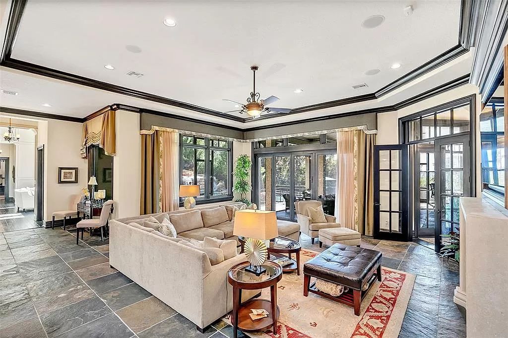 Situated within Windermere's exclusive community, this 10,485-square-foot estate at 6507 Rosella Ct embodies luxury living at its peak. Built by Stonebridge Custom Homes in 2007, the 7-bedroom, 8-bathroom property features an impressive array of amenities including a grand atrium with stunning lake views, a theater, two swimming pools, a spa, and an outdoor kitchen.