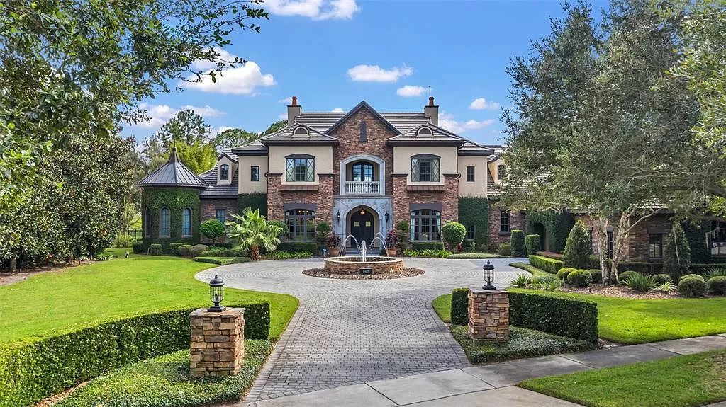 Situated within Windermere's exclusive community, this 10,485-square-foot estate at 6507 Rosella Ct embodies luxury living at its peak. Built by Stonebridge Custom Homes in 2007, the 7-bedroom, 8-bathroom property features an impressive array of amenities including a grand atrium with stunning lake views, a theater, two swimming pools, a spa, and an outdoor kitchen.