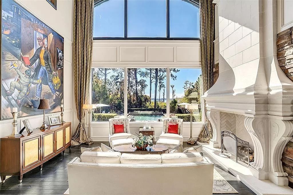 Situated within Windermere's exclusive community, this 10,485-square-foot estate at 6507 Rosella Ct embodies luxury living at its peak. Built by Stonebridge Custom Homes in 2007, the 7-bedroom, 8-bathroom property features an impressive array of amenities including a grand atrium with stunning lake views, a theater, two swimming pools, a spa, and an outdoor kitchen.
