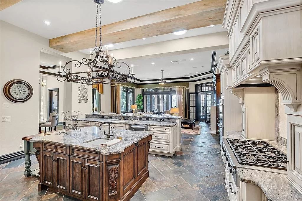 Situated within Windermere's exclusive community, this 10,485-square-foot estate at 6507 Rosella Ct embodies luxury living at its peak. Built by Stonebridge Custom Homes in 2007, the 7-bedroom, 8-bathroom property features an impressive array of amenities including a grand atrium with stunning lake views, a theater, two swimming pools, a spa, and an outdoor kitchen.