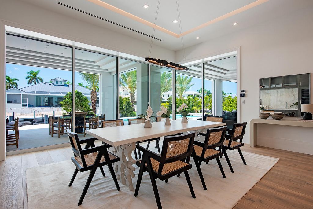 Nestled in the heart of Naples, Florida, 722 16th Ave S embodies the epitome of modern coastal living, seamlessly blending casual elegance with contemporary design. Boasting 5 bedrooms, 7 baths, and 6,224 square feet of living space, this newly constructed masterpiece, meticulously crafted by Falcon Design Inc., BBA Development Inc., and NP Interior Design