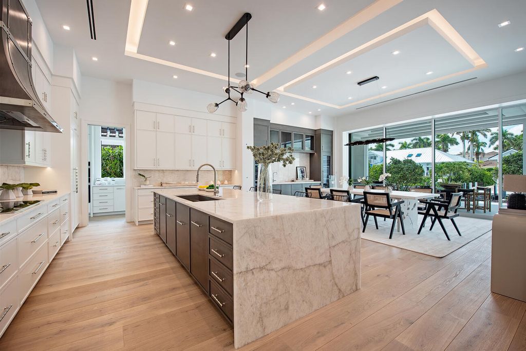 Nestled in the heart of Naples, Florida, 722 16th Ave S embodies the epitome of modern coastal living, seamlessly blending casual elegance with contemporary design. Boasting 5 bedrooms, 7 baths, and 6,224 square feet of living space, this newly constructed masterpiece, meticulously crafted by Falcon Design Inc., BBA Development Inc., and NP Interior Design