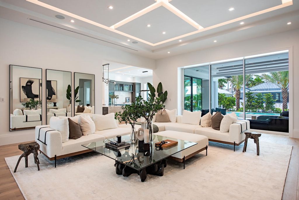 Nestled in the heart of Naples, Florida, 722 16th Ave S embodies the epitome of modern coastal living, seamlessly blending casual elegance with contemporary design. Boasting 5 bedrooms, 7 baths, and 6,224 square feet of living space, this newly constructed masterpiece, meticulously crafted by Falcon Design Inc., BBA Development Inc., and NP Interior Design