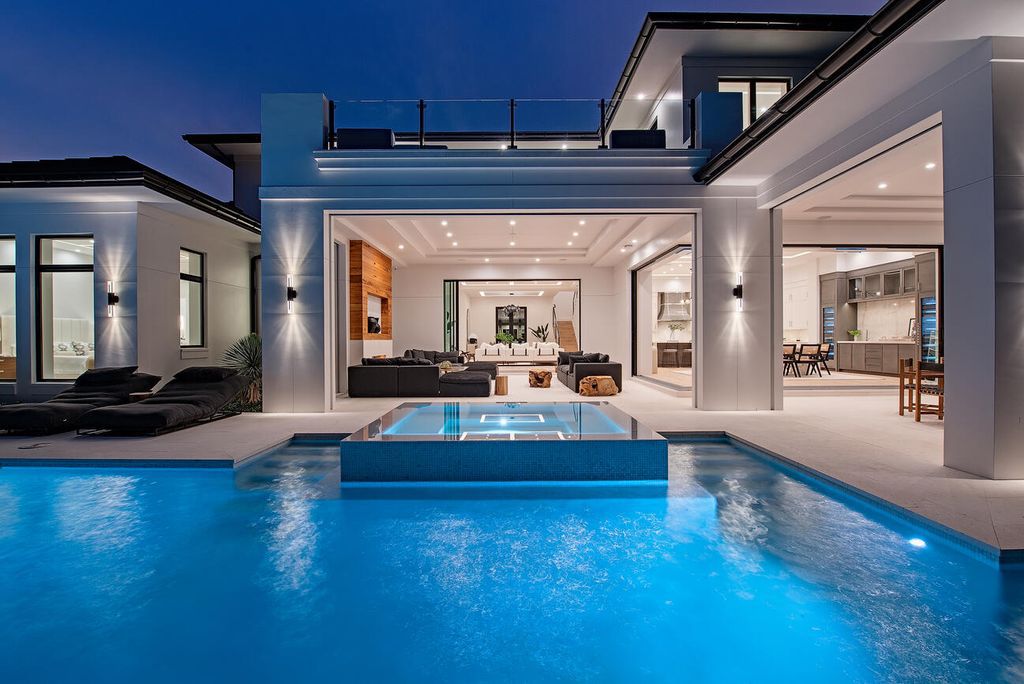 Nestled in the heart of Naples, Florida, 722 16th Ave S embodies the epitome of modern coastal living, seamlessly blending casual elegance with contemporary design. Boasting 5 bedrooms, 7 baths, and 6,224 square feet of living space, this newly constructed masterpiece, meticulously crafted by Falcon Design Inc., BBA Development Inc., and NP Interior Design
