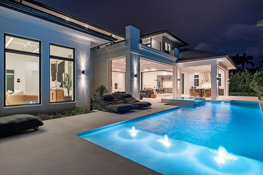 Nestled in the heart of Naples, Florida, 722 16th Ave S embodies the epitome of modern coastal living, seamlessly blending casual elegance with contemporary design. Boasting 5 bedrooms, 7 baths, and 6,224 square feet of living space, this newly constructed masterpiece, meticulously crafted by Falcon Design Inc., BBA Development Inc., and NP Interior Design