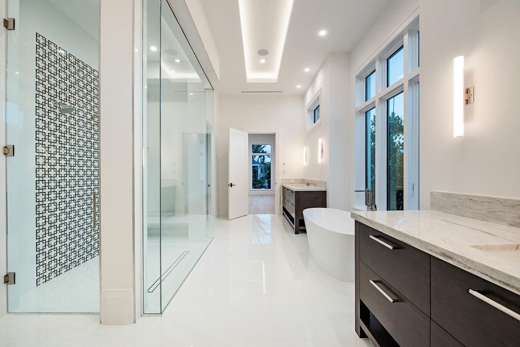 Nestled in the heart of Naples, Florida, 722 16th Ave S embodies the epitome of modern coastal living, seamlessly blending casual elegance with contemporary design. Boasting 5 bedrooms, 7 baths, and 6,224 square feet of living space, this newly constructed masterpiece, meticulously crafted by Falcon Design Inc., BBA Development Inc., and NP Interior Design