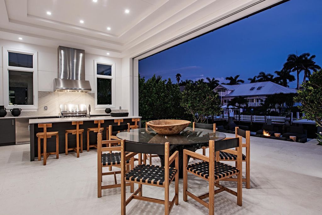 Nestled in the heart of Naples, Florida, 722 16th Ave S embodies the epitome of modern coastal living, seamlessly blending casual elegance with contemporary design. Boasting 5 bedrooms, 7 baths, and 6,224 square feet of living space, this newly constructed masterpiece, meticulously crafted by Falcon Design Inc., BBA Development Inc., and NP Interior Design