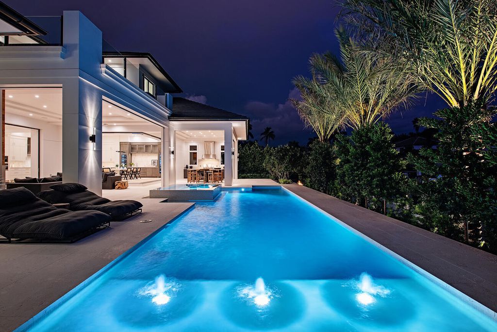 Nestled in the heart of Naples, Florida, 722 16th Ave S embodies the epitome of modern coastal living, seamlessly blending casual elegance with contemporary design. Boasting 5 bedrooms, 7 baths, and 6,224 square feet of living space, this newly constructed masterpiece, meticulously crafted by Falcon Design Inc., BBA Development Inc., and NP Interior Design