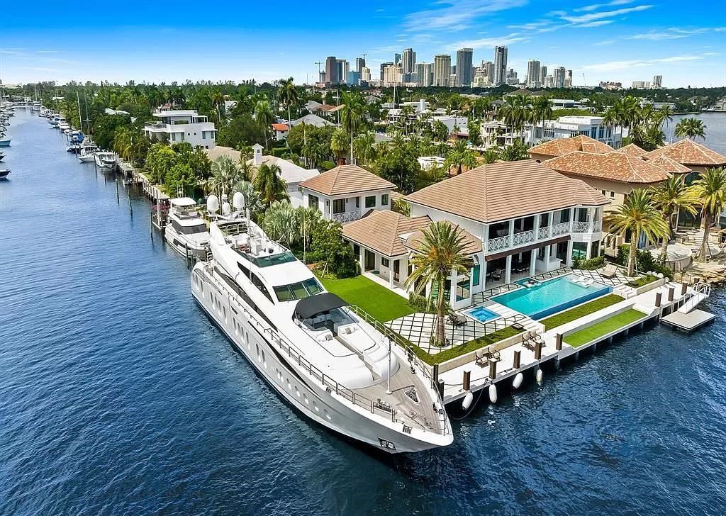 Immerse yourself in the epitome of the "South Florida Lifestyle" at this exquisitely renovated 6-bed, 8-bath West Indies Oasis at 1812 SE 14th St, Fort Lauderdale, FL. This 7,221 sq ft estate boasts a grand Great Room with 20' ceilings and panoramic water views, a media room, and a chef's kitchen with a La’Corneu gas range.
