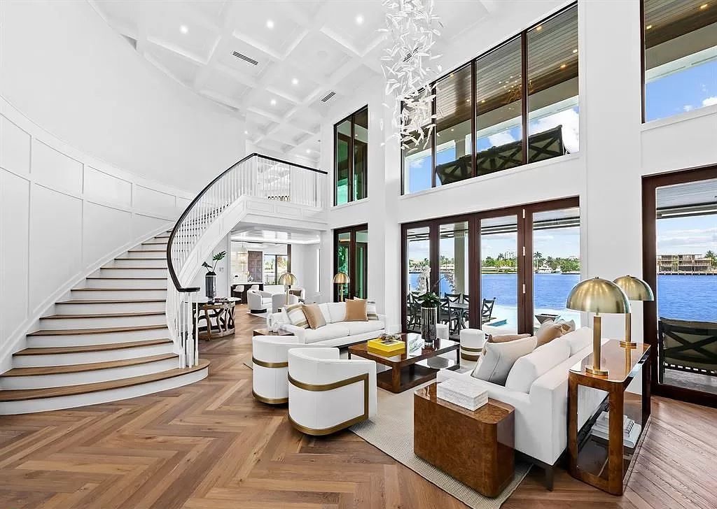 Immerse yourself in the epitome of the "South Florida Lifestyle" at this exquisitely renovated 6-bed, 8-bath West Indies Oasis at 1812 SE 14th St, Fort Lauderdale, FL. This 7,221 sq ft estate boasts a grand Great Room with 20' ceilings and panoramic water views, a media room, and a chef's kitchen with a La’Corneu gas range.