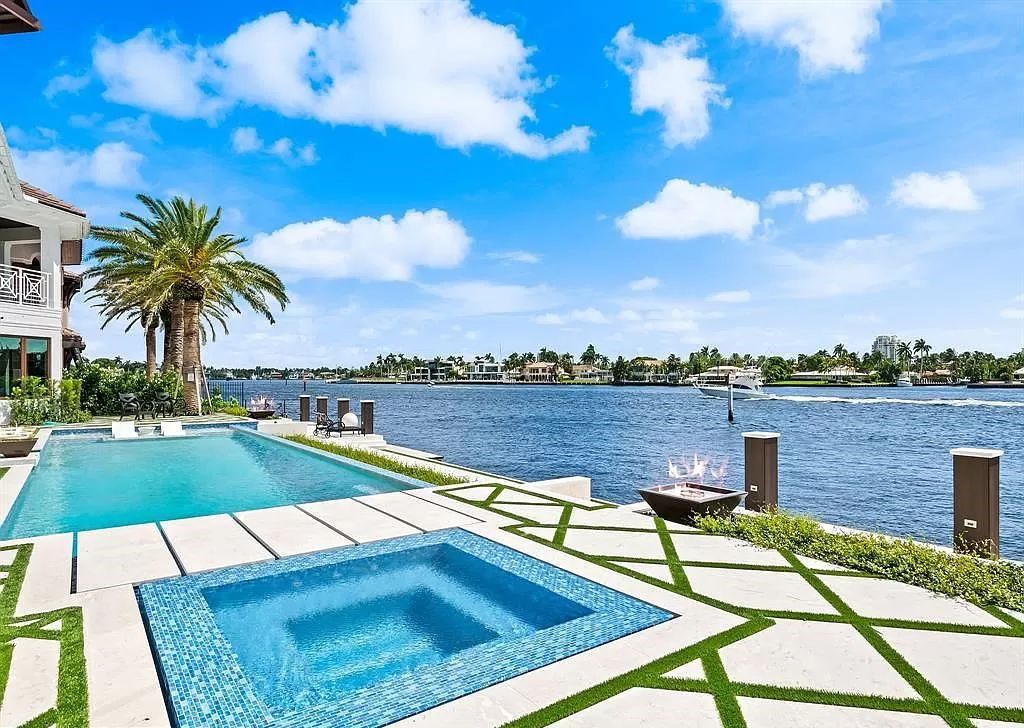 Immerse yourself in the epitome of the "South Florida Lifestyle" at this exquisitely renovated 6-bed, 8-bath West Indies Oasis at 1812 SE 14th St, Fort Lauderdale, FL. This 7,221 sq ft estate boasts a grand Great Room with 20' ceilings and panoramic water views, a media room, and a chef's kitchen with a La’Corneu gas range.