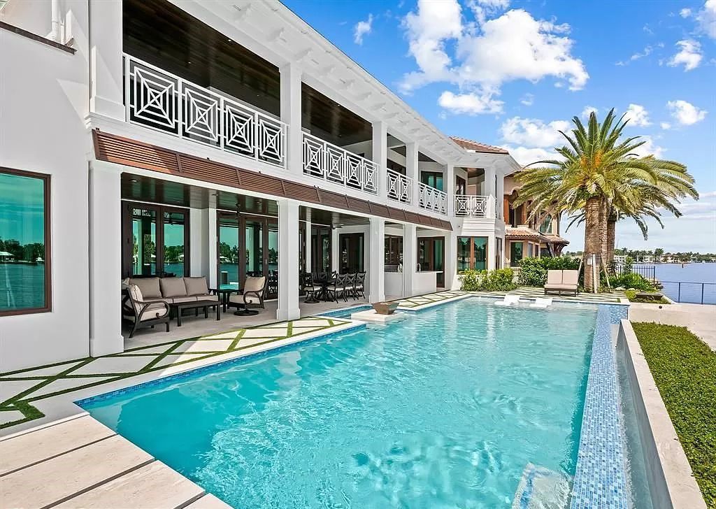 Immerse yourself in the epitome of the "South Florida Lifestyle" at this exquisitely renovated 6-bed, 8-bath West Indies Oasis at 1812 SE 14th St, Fort Lauderdale, FL. This 7,221 sq ft estate boasts a grand Great Room with 20' ceilings and panoramic water views, a media room, and a chef's kitchen with a La’Corneu gas range.