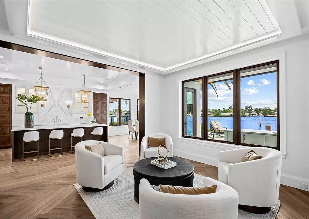 Immerse yourself in the epitome of the "South Florida Lifestyle" at this exquisitely renovated 6-bed, 8-bath West Indies Oasis at 1812 SE 14th St, Fort Lauderdale, FL. This 7,221 sq ft estate boasts a grand Great Room with 20' ceilings and panoramic water views, a media room, and a chef's kitchen with a La’Corneu gas range.