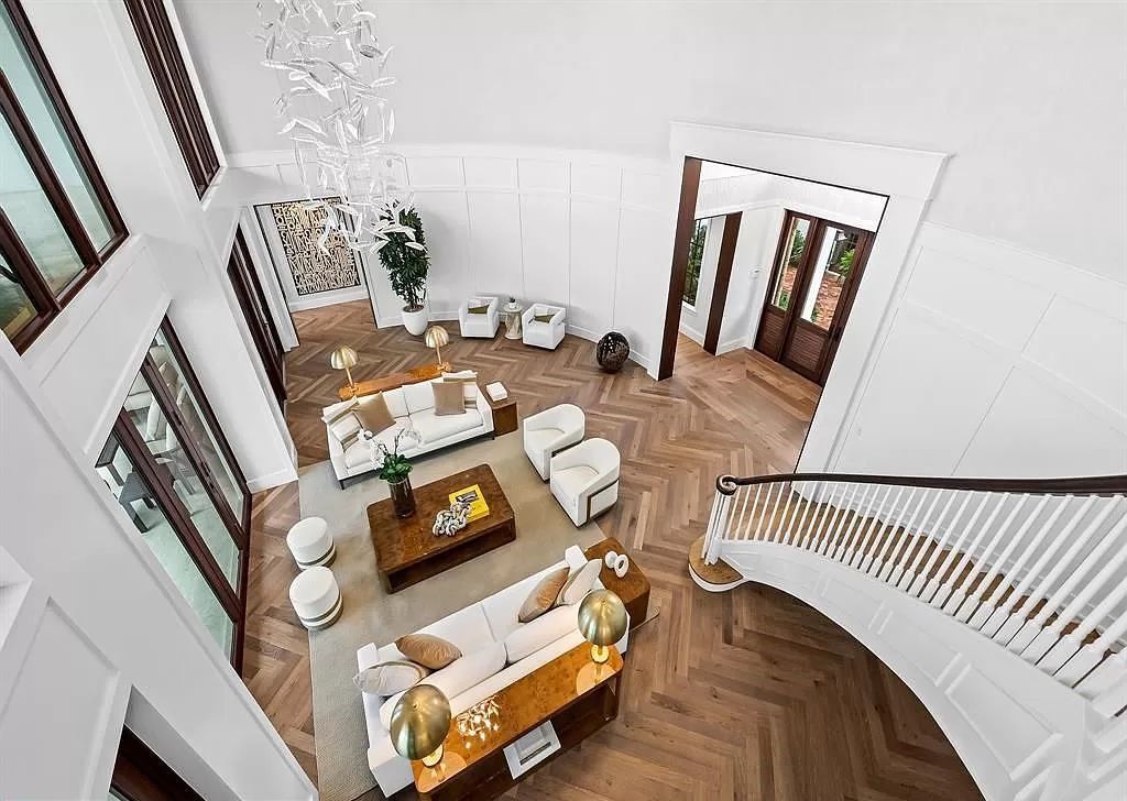 Immerse yourself in the epitome of the "South Florida Lifestyle" at this exquisitely renovated 6-bed, 8-bath West Indies Oasis at 1812 SE 14th St, Fort Lauderdale, FL. This 7,221 sq ft estate boasts a grand Great Room with 20' ceilings and panoramic water views, a media room, and a chef's kitchen with a La’Corneu gas range.