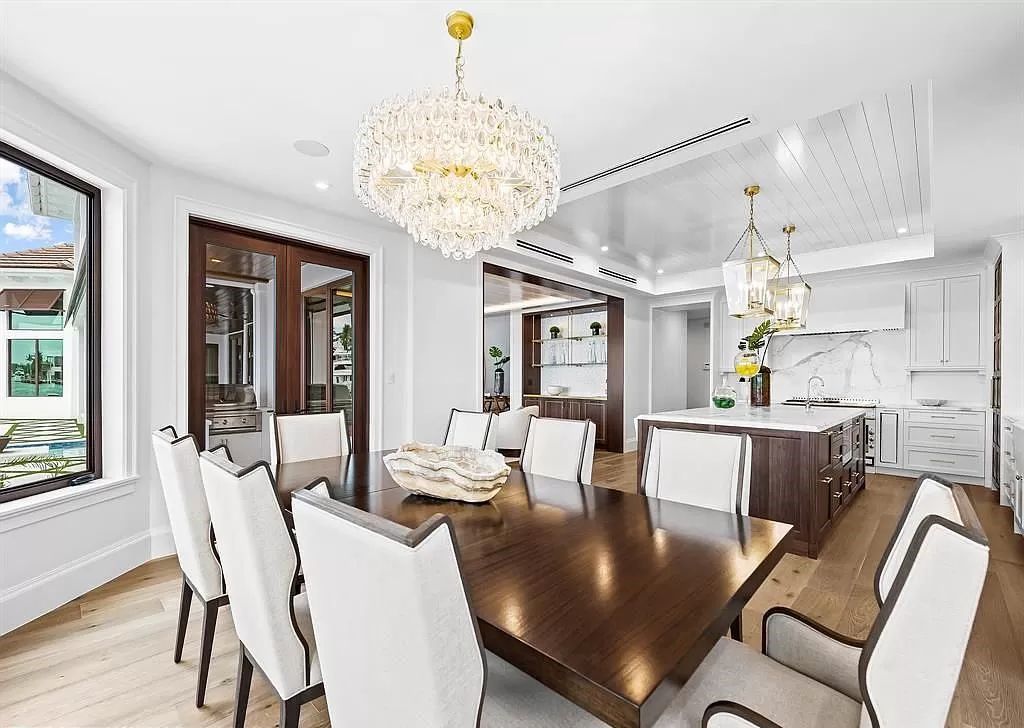 Immerse yourself in the epitome of the "South Florida Lifestyle" at this exquisitely renovated 6-bed, 8-bath West Indies Oasis at 1812 SE 14th St, Fort Lauderdale, FL. This 7,221 sq ft estate boasts a grand Great Room with 20' ceilings and panoramic water views, a media room, and a chef's kitchen with a La’Corneu gas range.